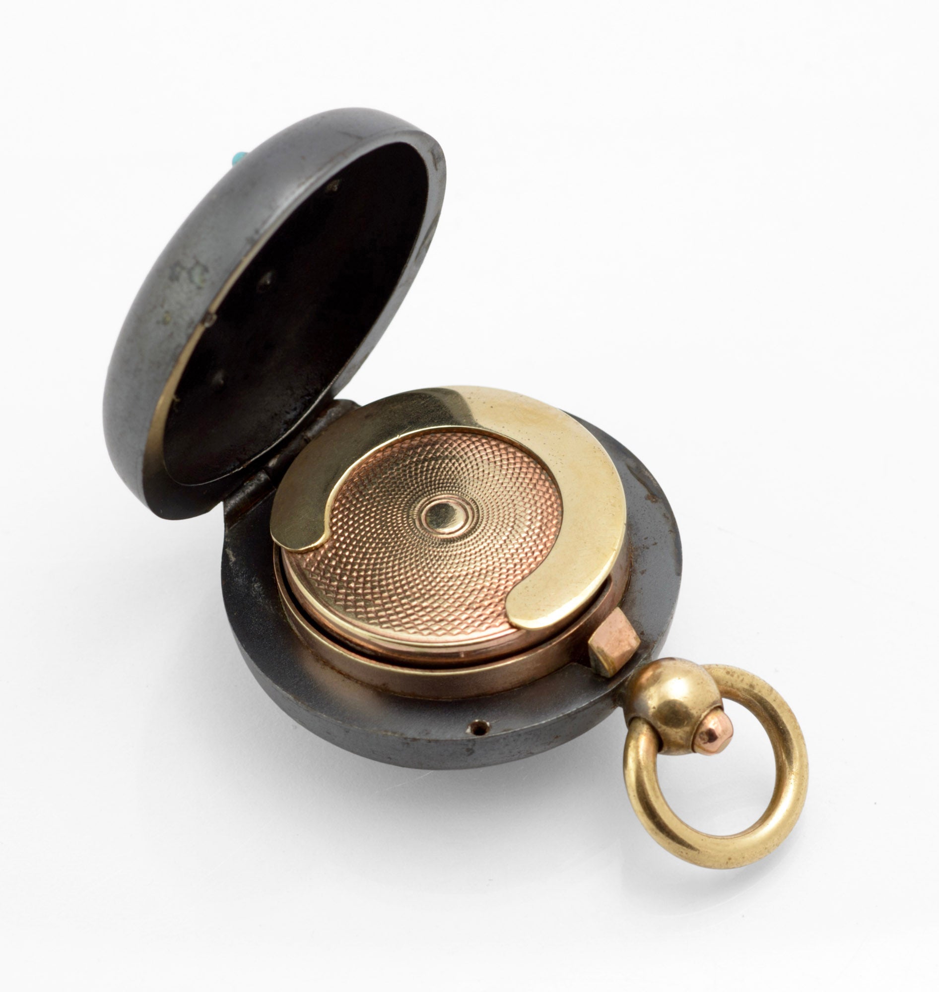 Antique gun metal sovereign case open side view showing spring loaded pusher depth brass mechanism and press button catch adjacent to suspension loop on white background