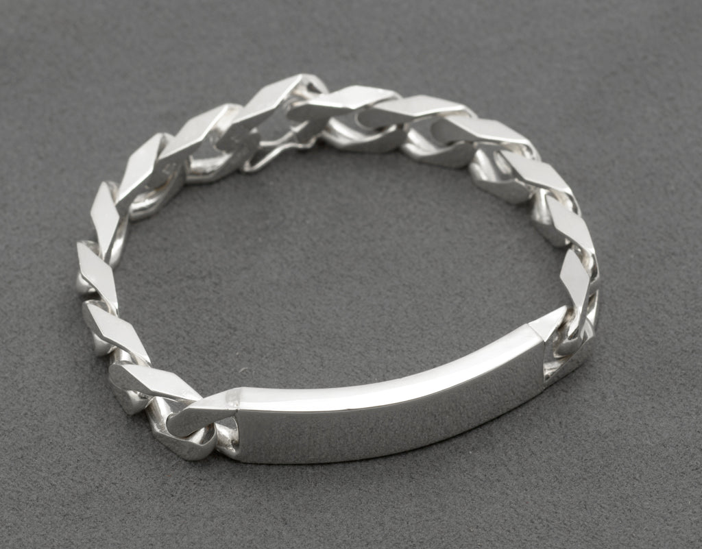 Close up of Italian sterling silver ID bracelet push-piece box clasp open showing figure-8 safety catch and clasp link separated from chain with Italy 925 and HPJ maker stamps visible