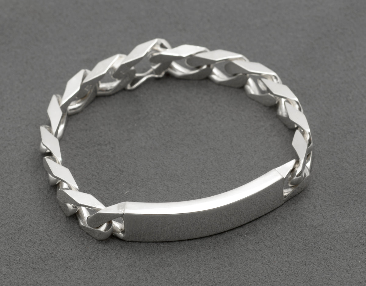 Close up of Italian sterling silver ID bracelet push-piece box clasp open showing figure-8 safety catch and clasp link separated from chain with Italy 925 and HPJ maker stamps visible