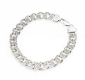 Vintage sterling silver curb chain bracelet with cubic zirconia set links, close up detail showing six CZ stones to each link
