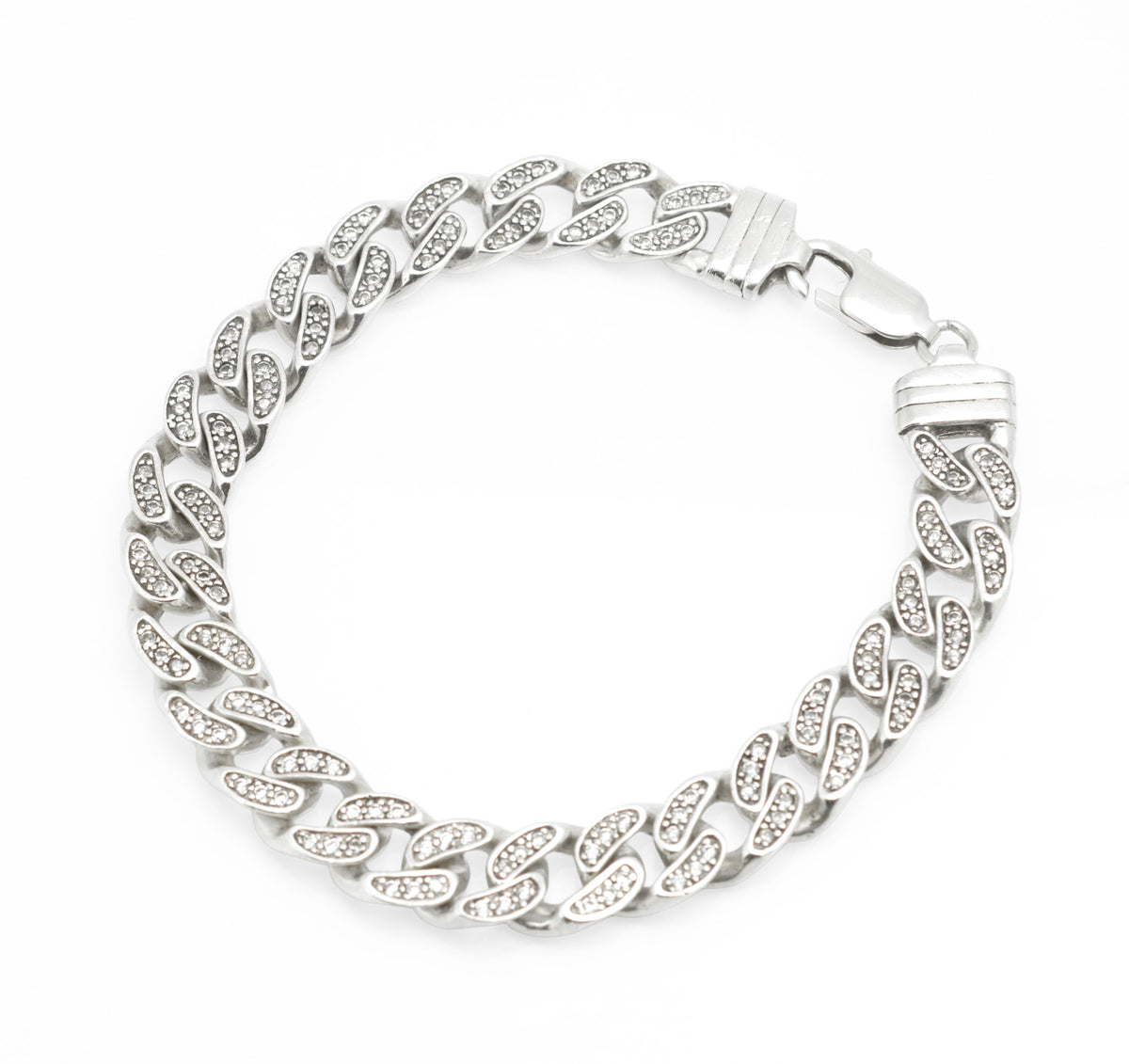 Vintage sterling silver curb chain bracelet with cubic zirconia set links, close up detail showing six CZ stones to each link