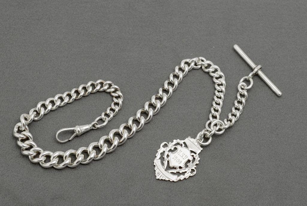 Antique sterling silver Albert watch chain T bar close up showing hallmarks to each arm, Birmingham 1895