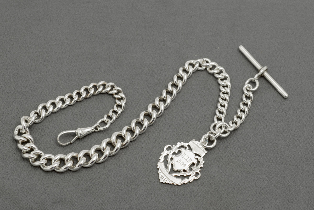 Antique sterling silver Albert watch chain T bar close up showing hallmarks to each arm, Birmingham 1895