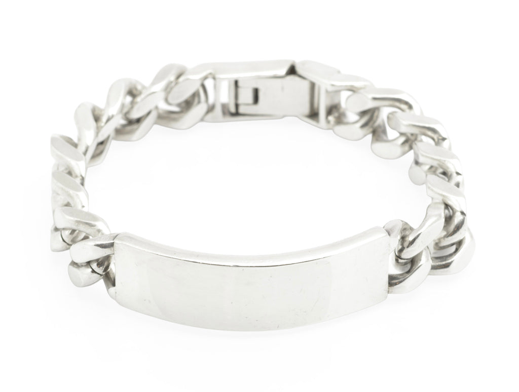 Vintage sterling silver ID bracelet side profile view on white background showing plain ID panel, broad curb links and clasp