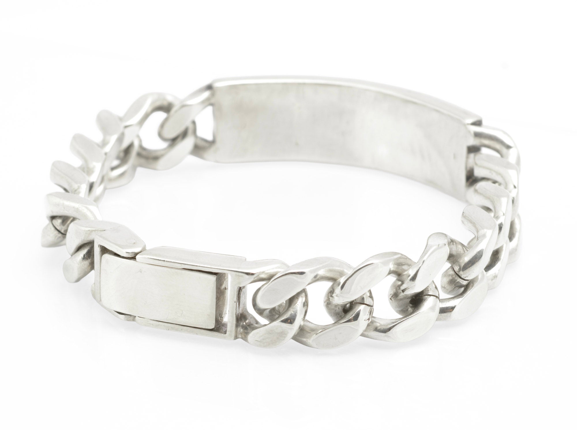 Vintage sterling silver ID bracelet full view on grey background showing broad polished curb links and plain unengraved ID panel