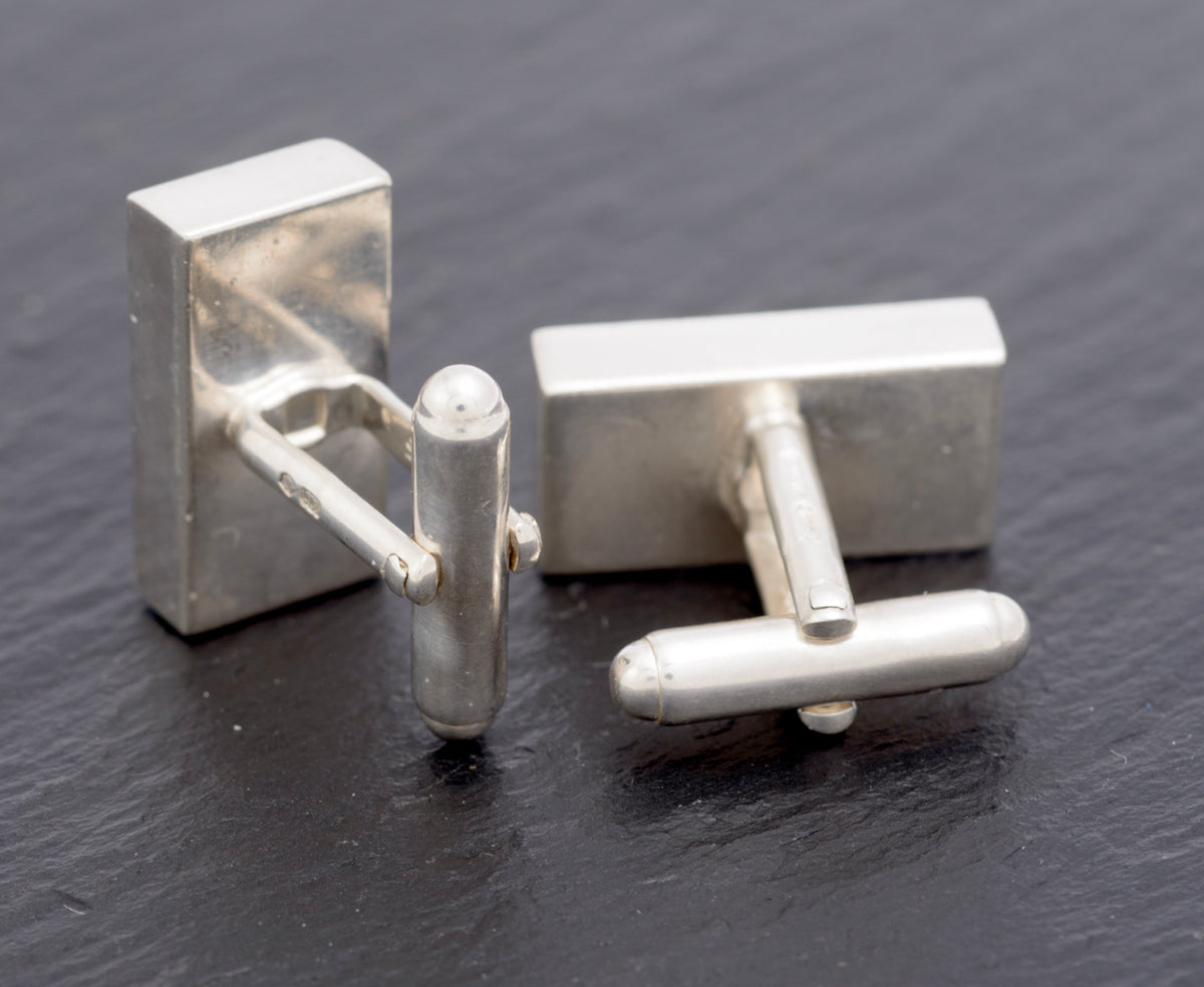 Vintage Gucci Trademark sterling silver cufflinks pair rear view showing one toggle open and one closed with plain slab backs