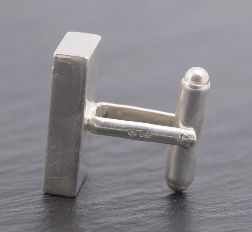 Vintage Gucci Trademark sterling silver cufflink single close up side view showing 925 and Italian assay marks on post with Swiss St. Bernard hallmark