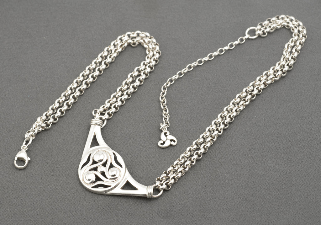 Vintage Ola Gorie sterling silver necklet full laid flat view on grey background showing adjustable extension chain and triskelion terminal charm