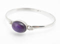 Vintage sterling silver amethyst cabochon bangle, Birmingham 2009 maker CR, bezel set oval purple stone - front view