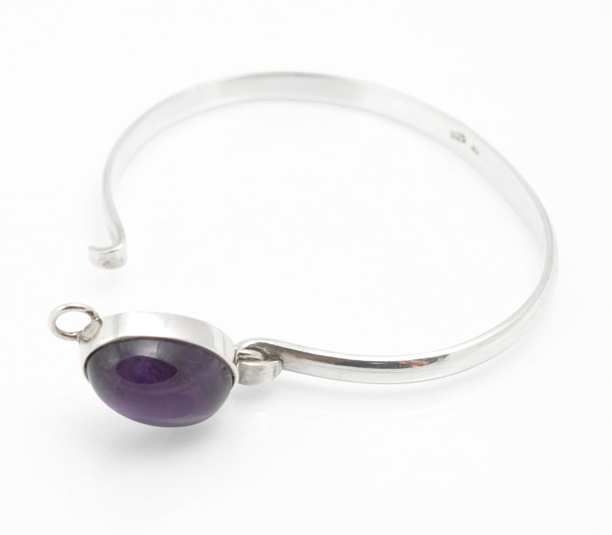 Vintage sterling silver amethyst cabochon bangle, purple oval stone and slim silver band - angled view