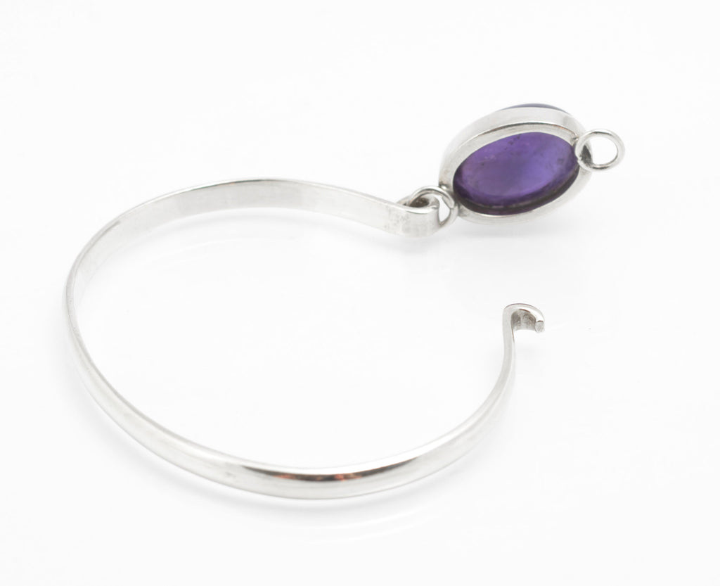 Sterling silver amethyst bangle with bezel set cabochon, shown from the reverse and side