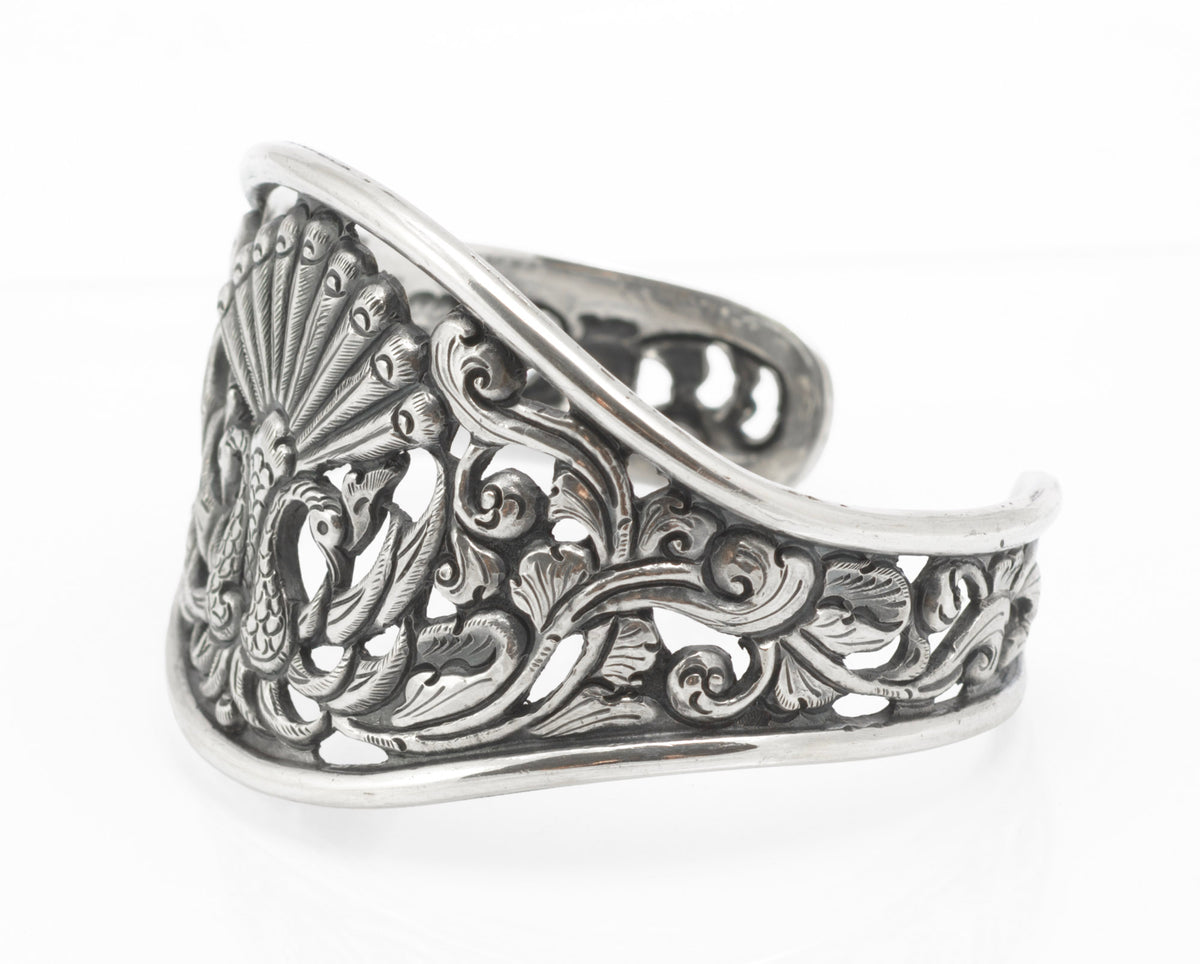 Vintage Yogya 800 silver cuff bangle reverse side view showing scrolling foliage openwork across full band