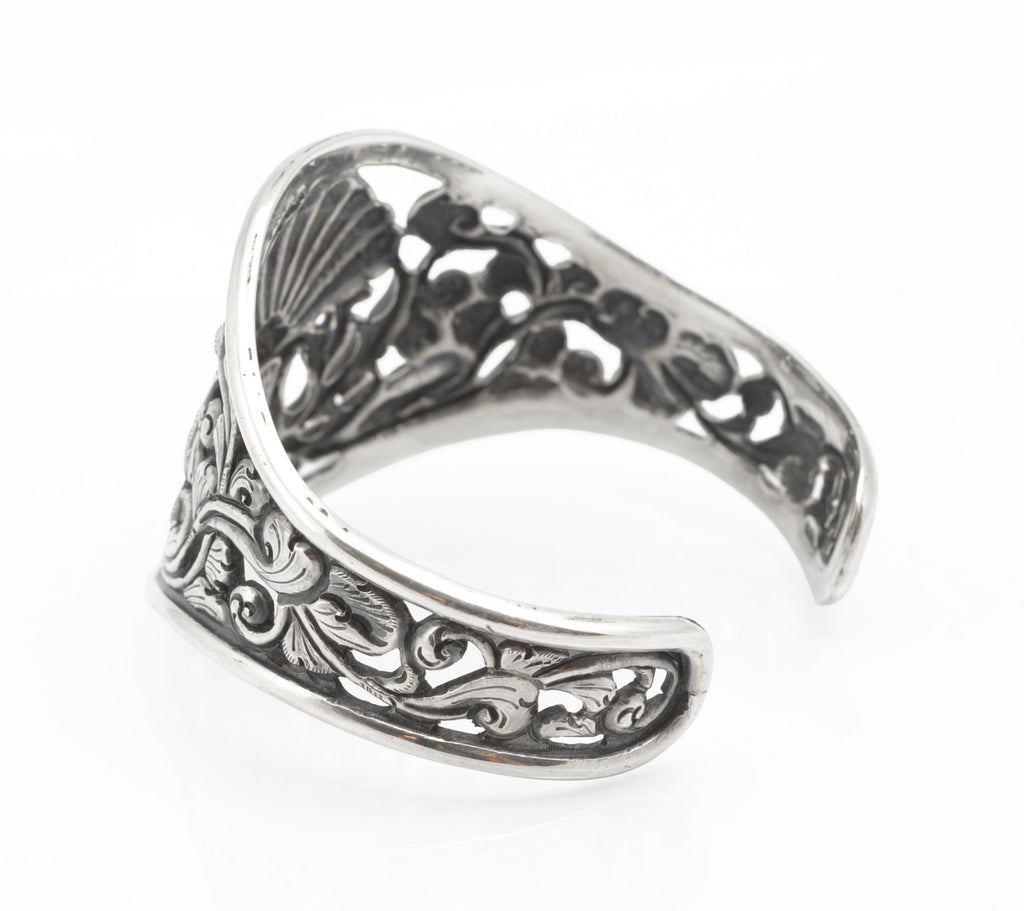 Vintage Yogya 800 silver cuff bangle top down flat view showing full peacock and foliate composition across centre panel