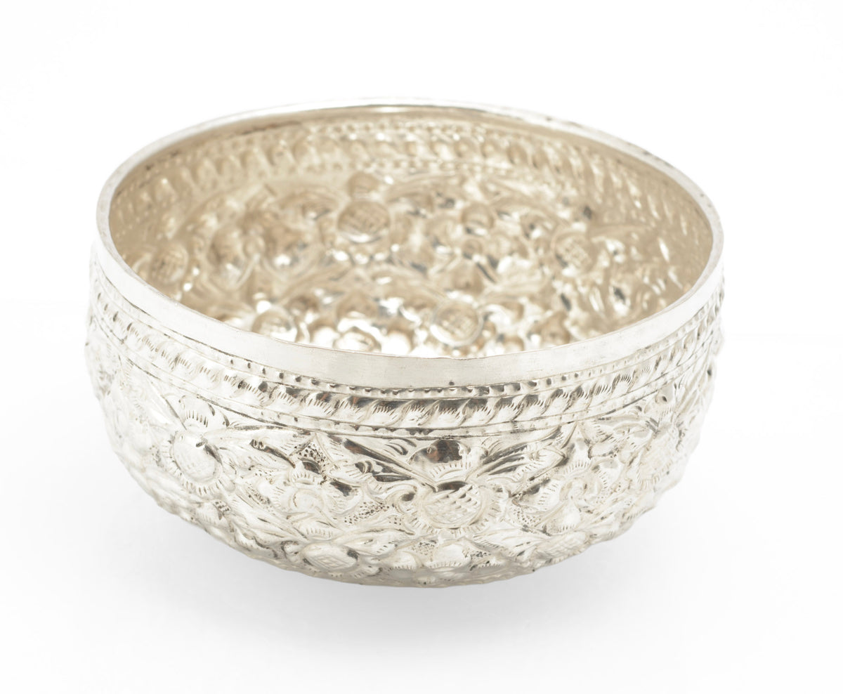 Mid century Thai silver offering bowl with repousse floral decoration viewed from the front