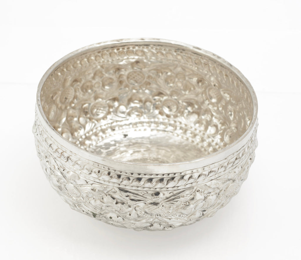 Underside of handmade Thai silver offering bowl showing the base and decorative edge