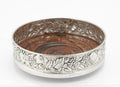 Sterling silver repousse bottle coaster by Falsini Ferruccio Florence, grapevine and fruit band, turned hardwood base - view from above and side
