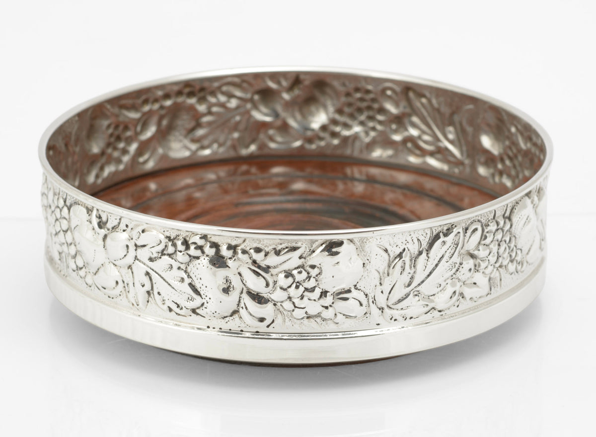 Sterling silver repousse bottle coaster by Falsini Ferruccio Florence, plain upper rim and grapevine band - exterior side view