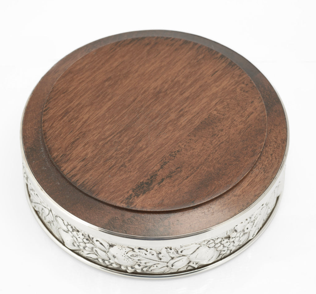 Sterling silver repousse bottle coaster by Falsini Ferruccio Florence, flat hardwood base - view from below