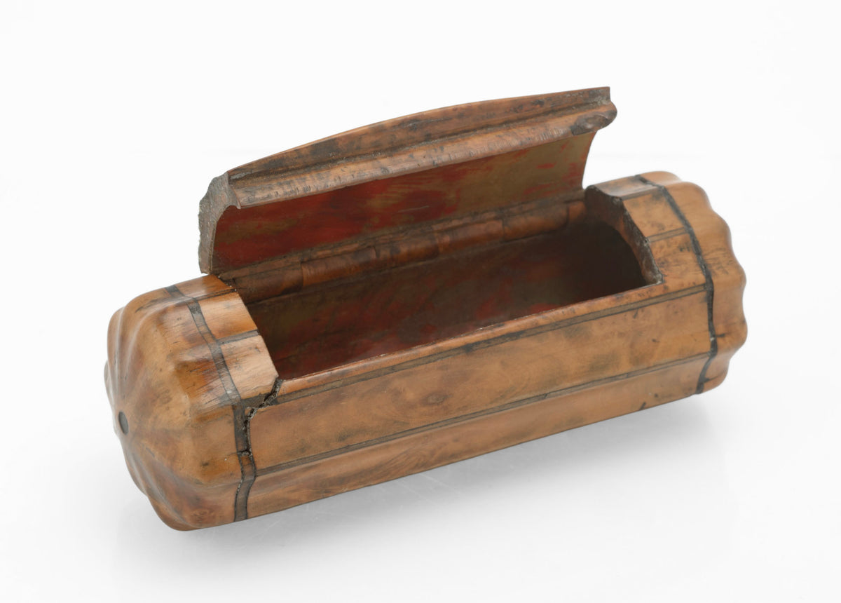 Side view of antique burr walnut snuff box showing fluted barrel body and contrasting wood stringing