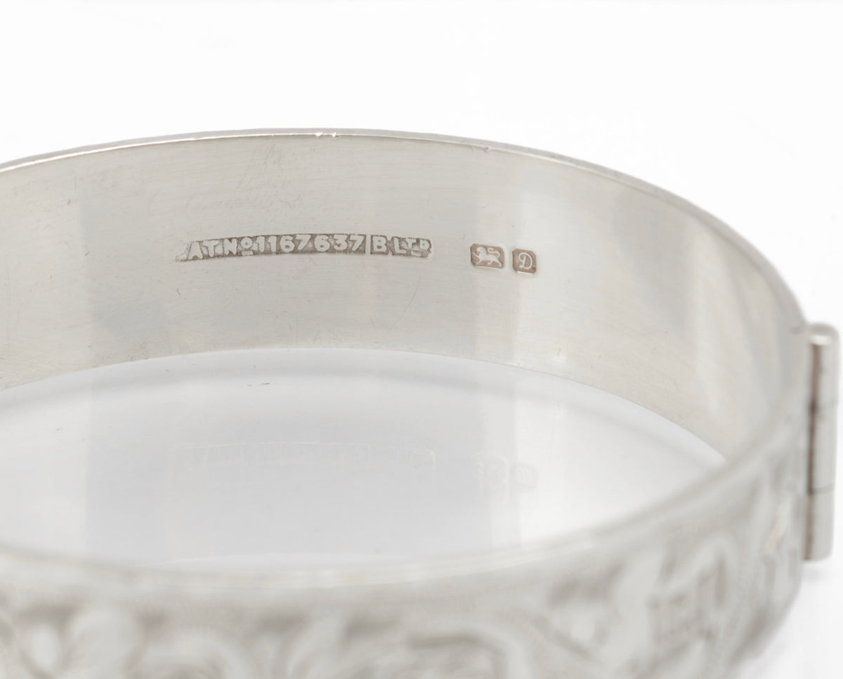 Vintage sterling silver Bracelon Ltd bangle Birmingham 1978, engraved scrolling foliage - three quarter view