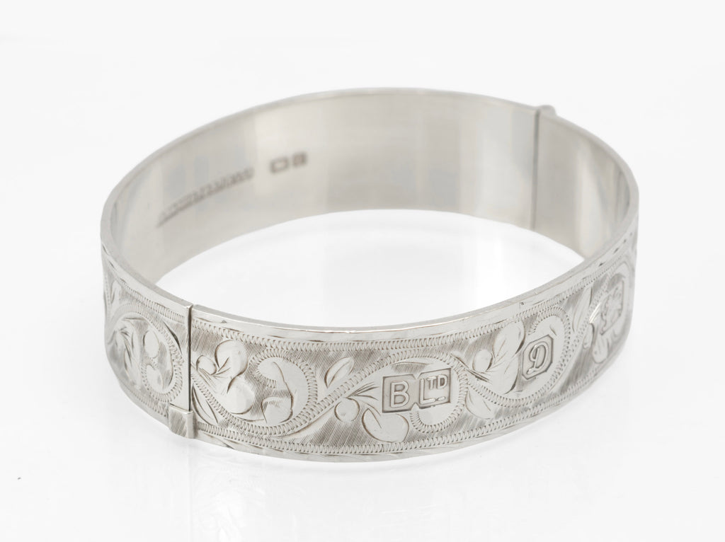 Sterling silver Bracelon Ltd bangle showing engraved foliage and side tension clasp - exterior view