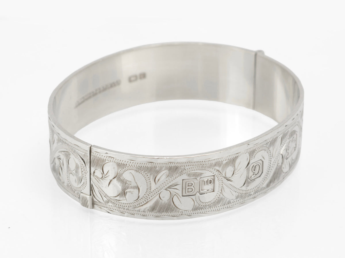 Sterling silver Bracelon Ltd bangle showing engraved foliage and side tension clasp - exterior view