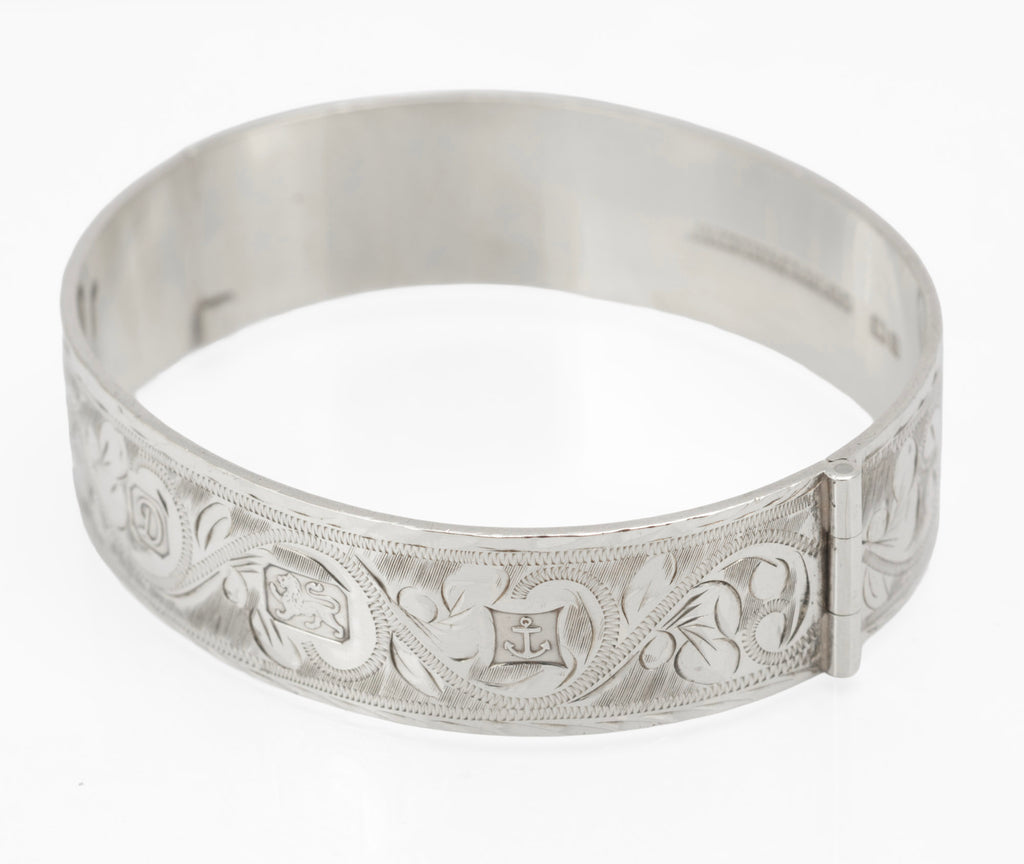 Sterling silver Bracelon Ltd bangle showing side tension clasp and open hinge mechanism