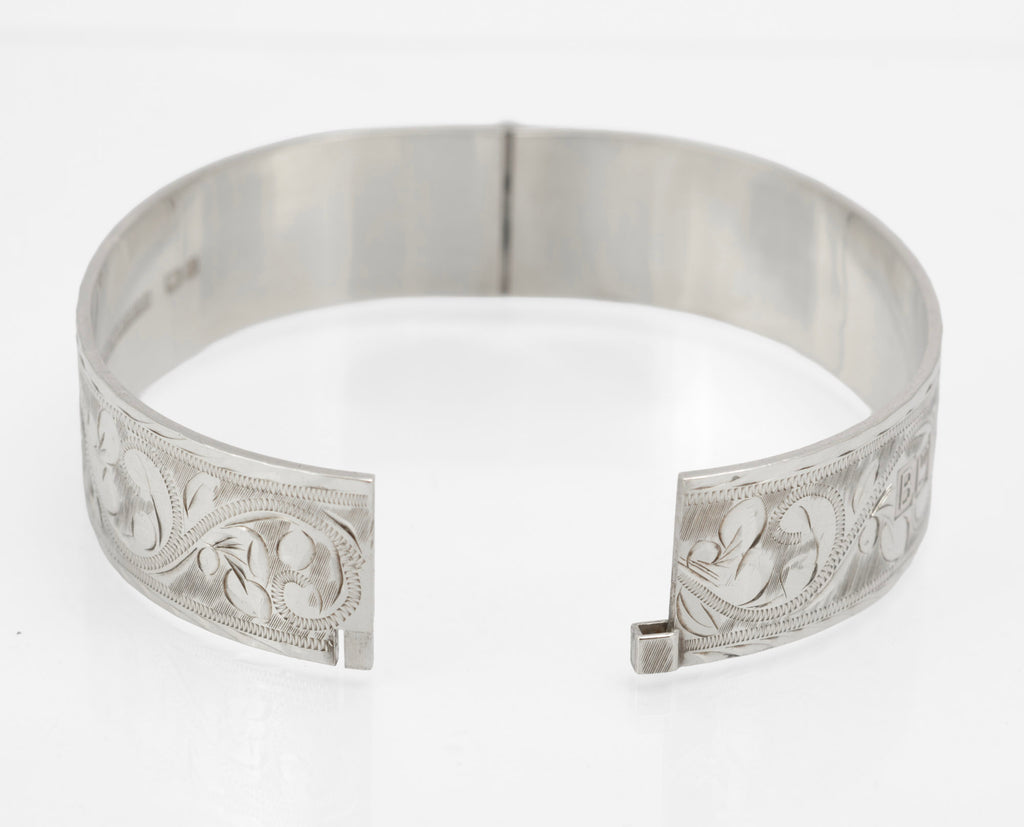 Interior of sterling silver Bracelon Ltd bangle showing PAT No 1167637, maker mark and repeat hallmarks