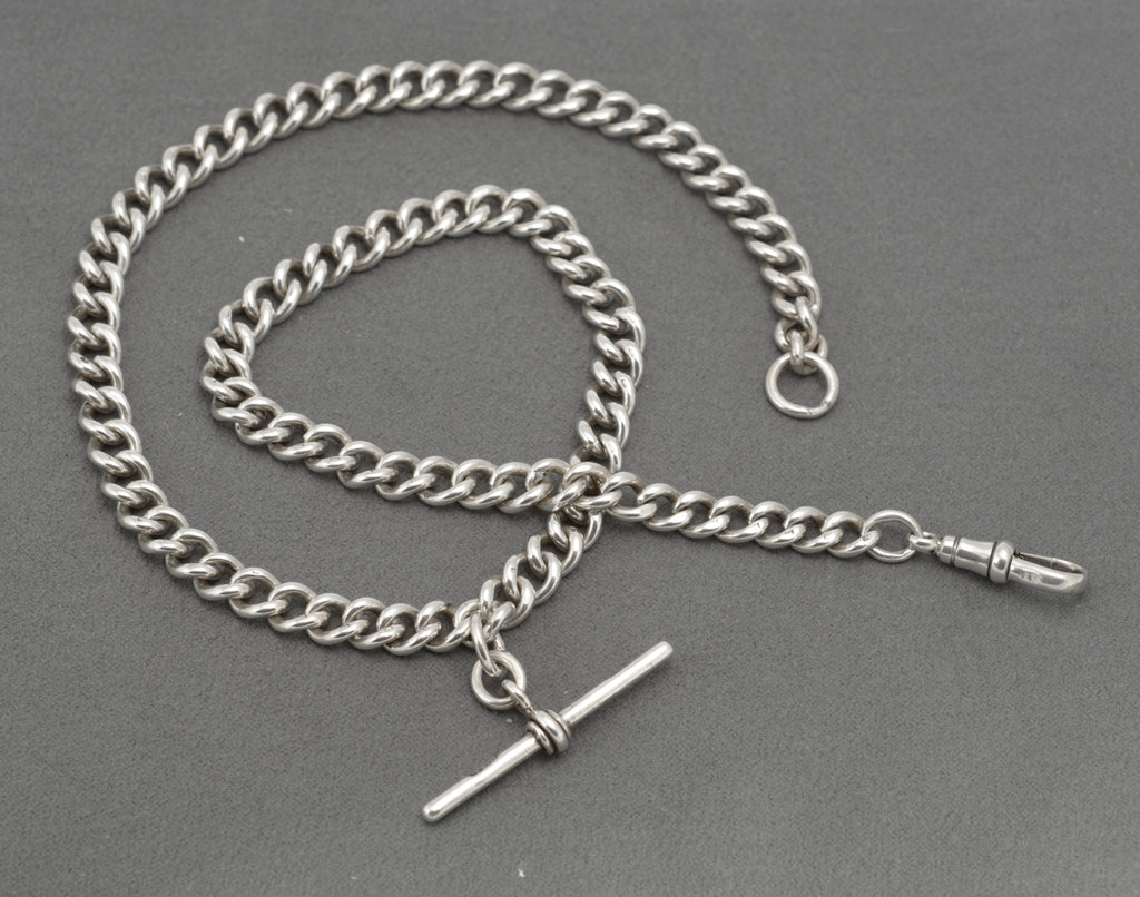 Antique sterling silver double Albert watch chain showing terminal jump ring and curb links