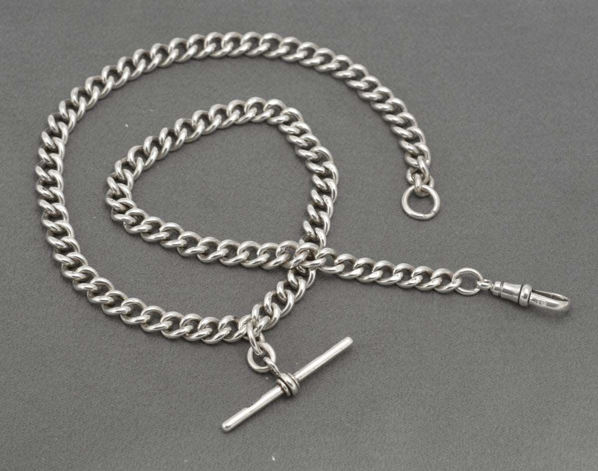 Antique sterling silver double Albert watch chain showing terminal jump ring and curb links