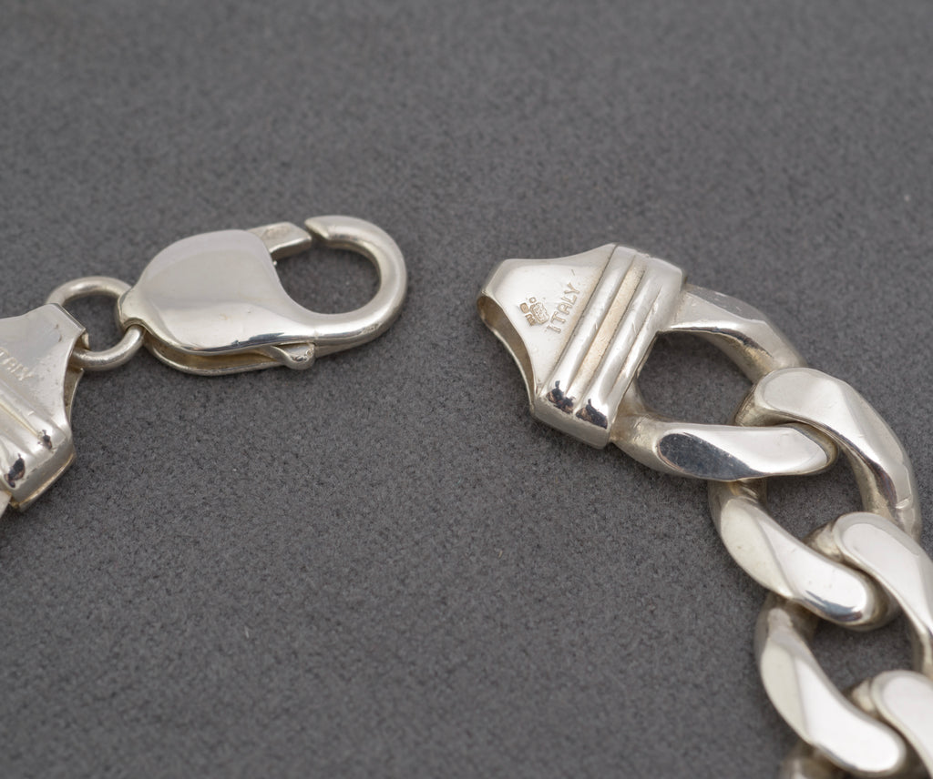 Italian sterling silver flat curb link bracelet showing lobster clasp and 925 mark