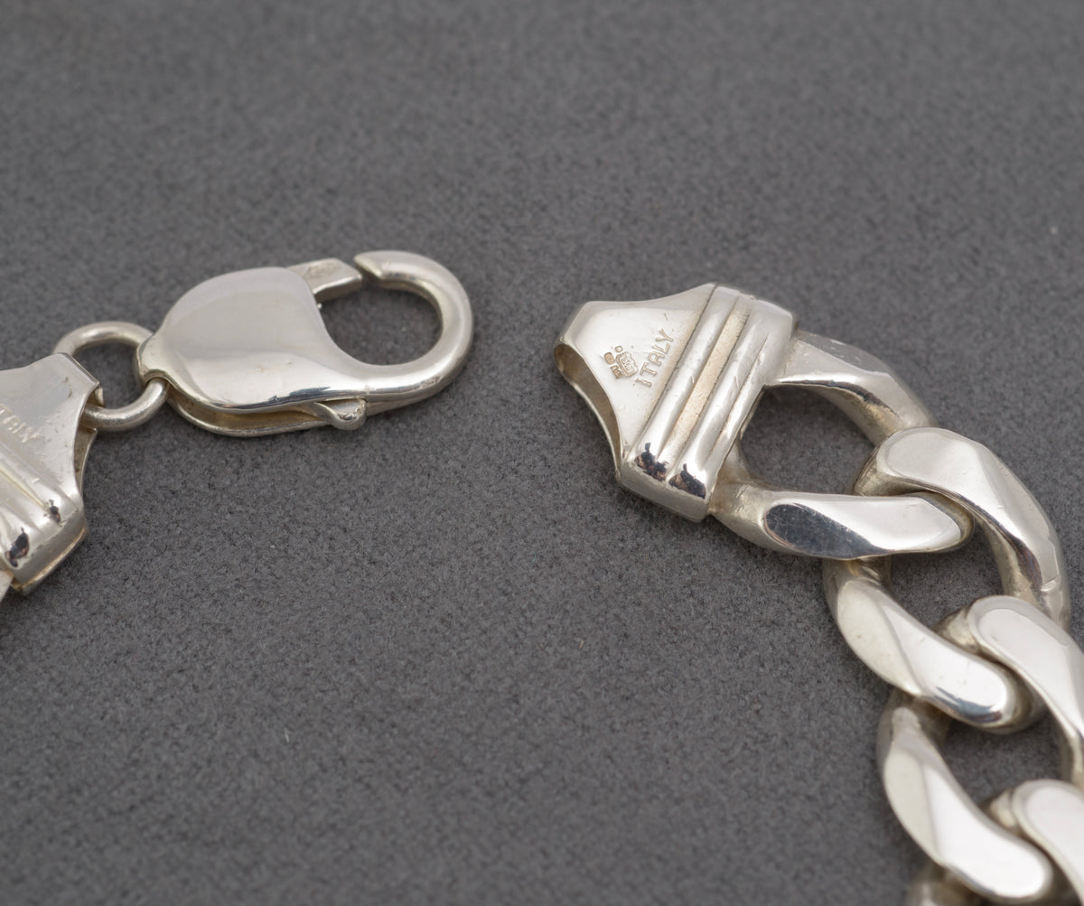 Italian sterling silver flat curb link bracelet showing lobster clasp and 925 mark