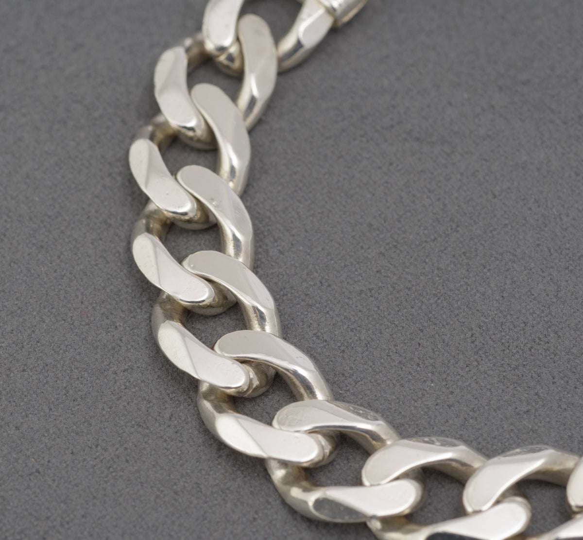 Italian sterling silver bracelet, close view of broad flat curb links and polished surfaces