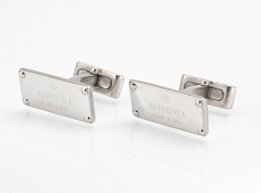 Vintage Gucci sterling silver cufflinks showing the rear toggle backs and curved posts