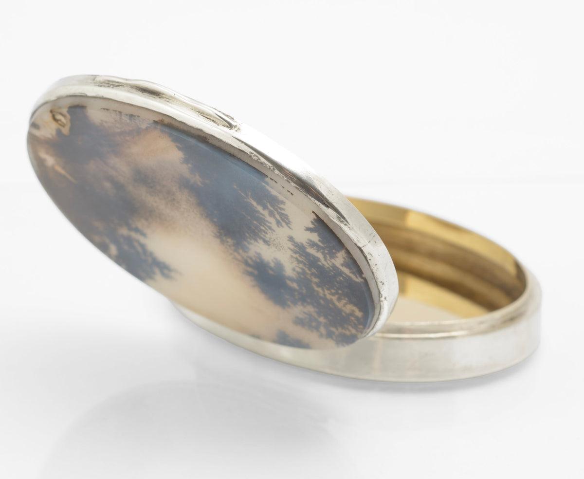 Antique sterling silver oval box shown open to display the natural moss agate lid and gilt washed interior