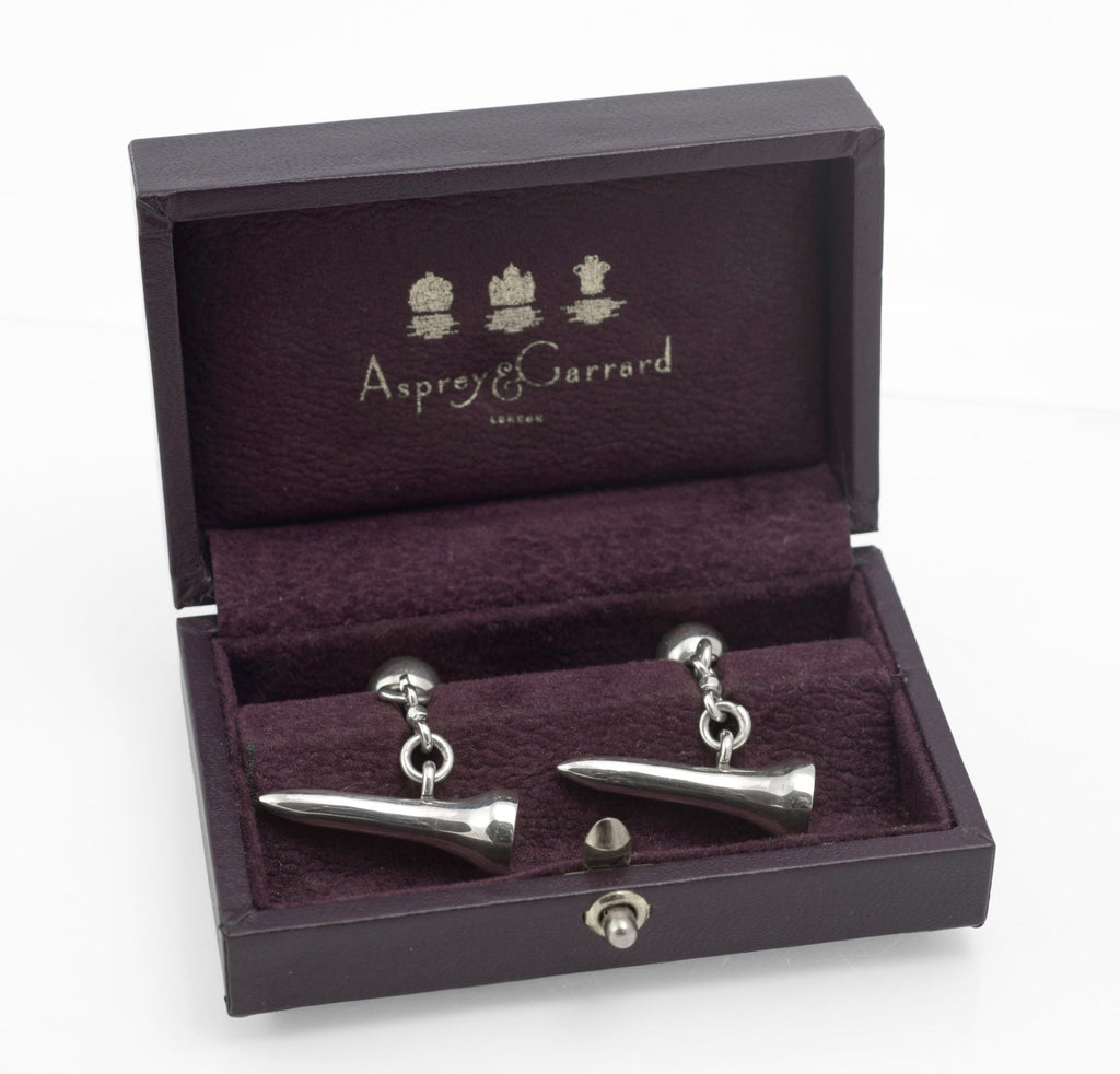 Vintage Asprey and Garrard sterling silver golf tee cufflinks displayed in their original fitted purple box