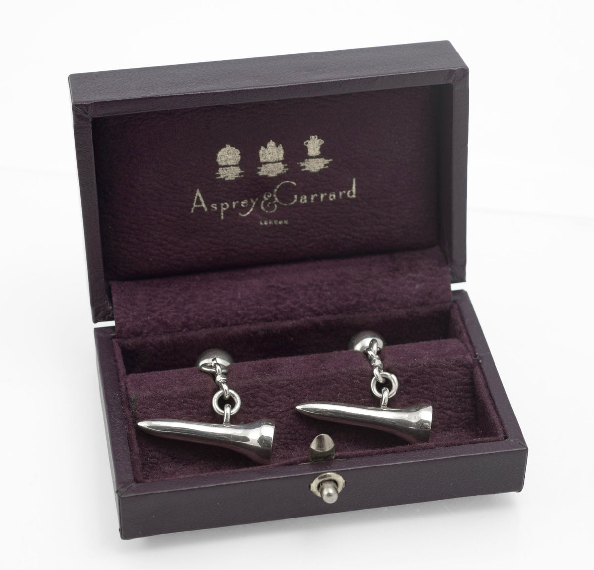 Vintage Asprey and Garrard sterling silver golf tee cufflinks displayed in their original fitted purple box