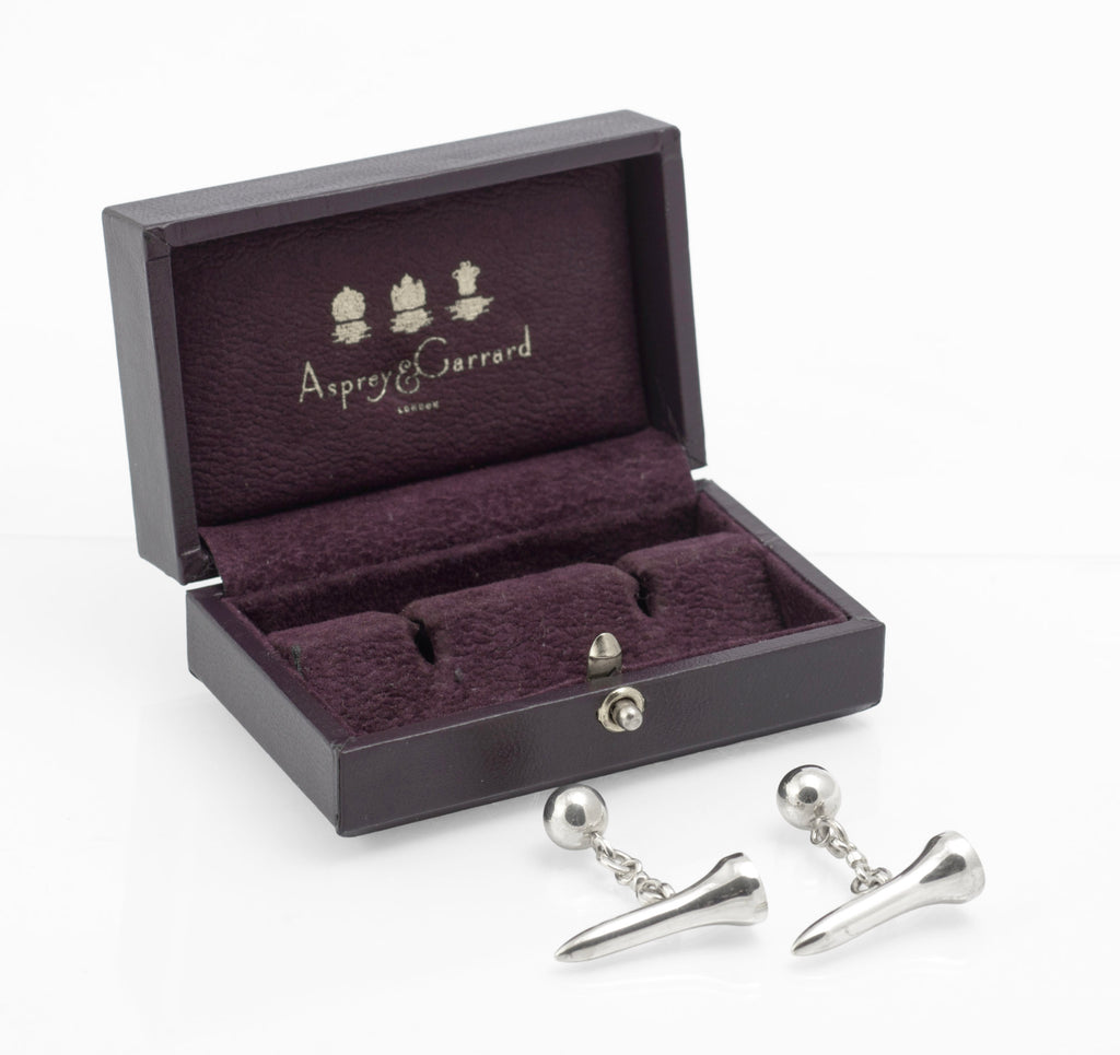 Close view of vintage sterling silver golf tee cufflinks with articulated chain links and ball form backs
