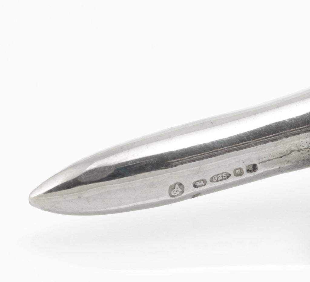 Close view of the London 1999 hallmark and 925 mark on a vintage sterling silver golf tee cufflink