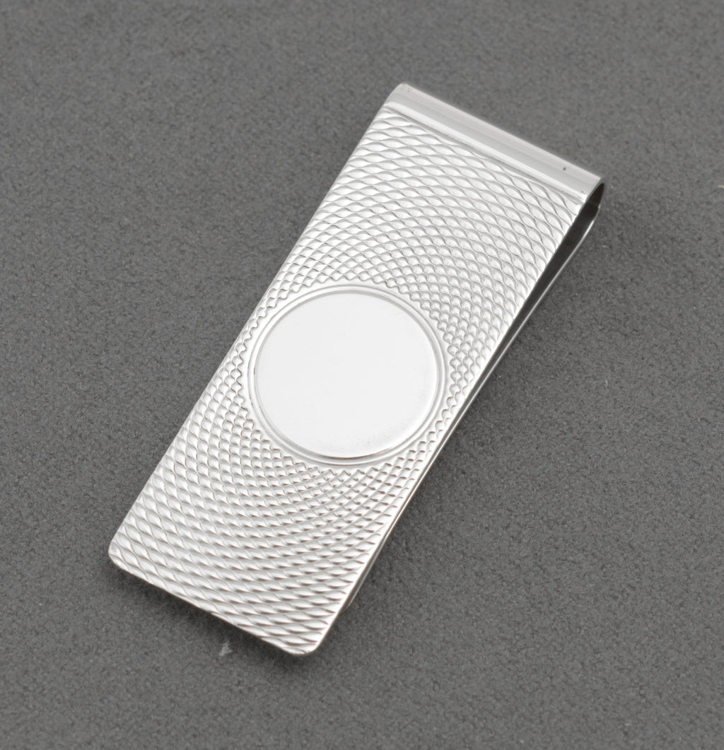 Vintage sterling silver money clip shown open with the William Manton hallmark visible