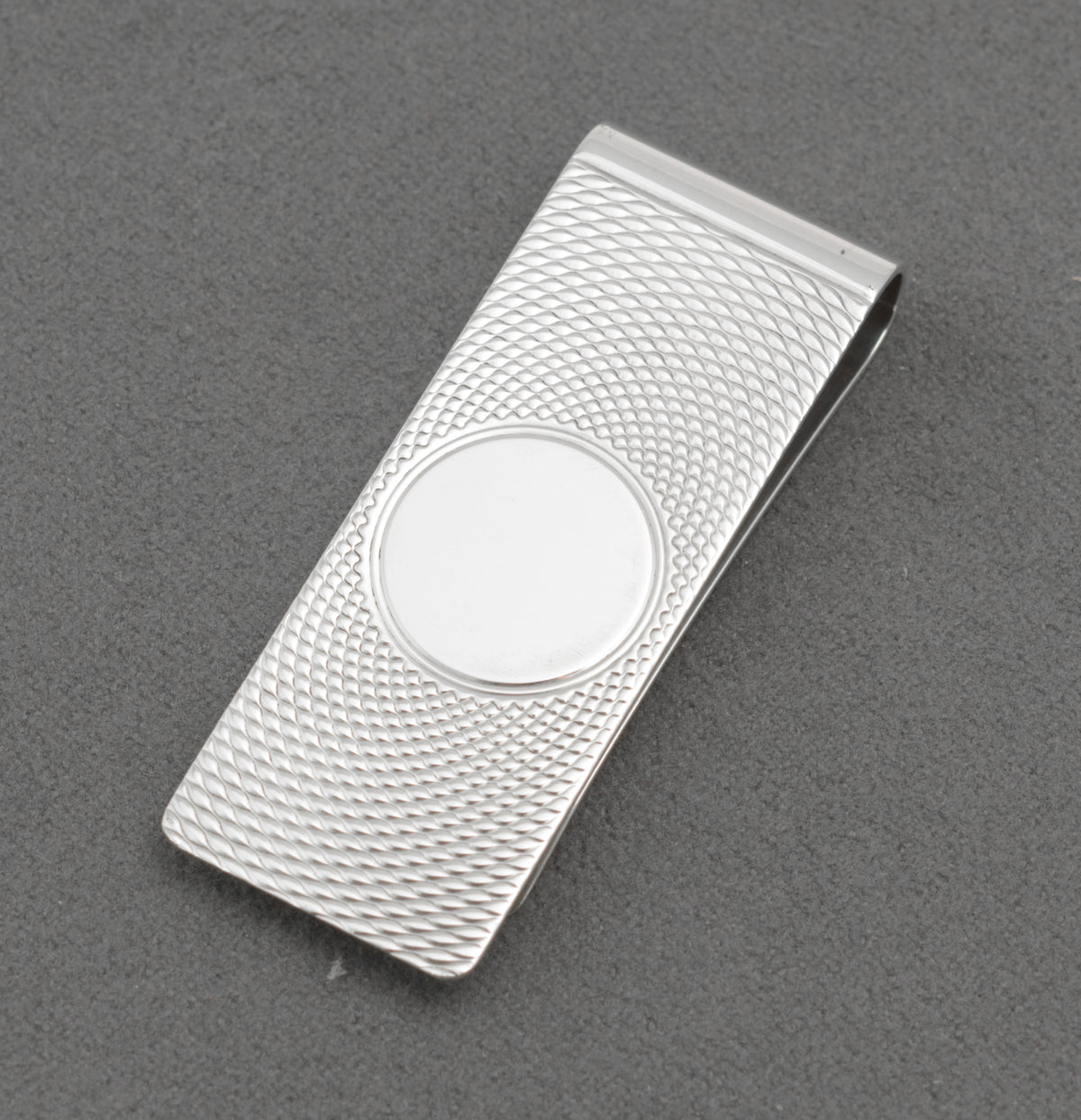 Vintage sterling silver money clip shown open with the William Manton hallmark visible