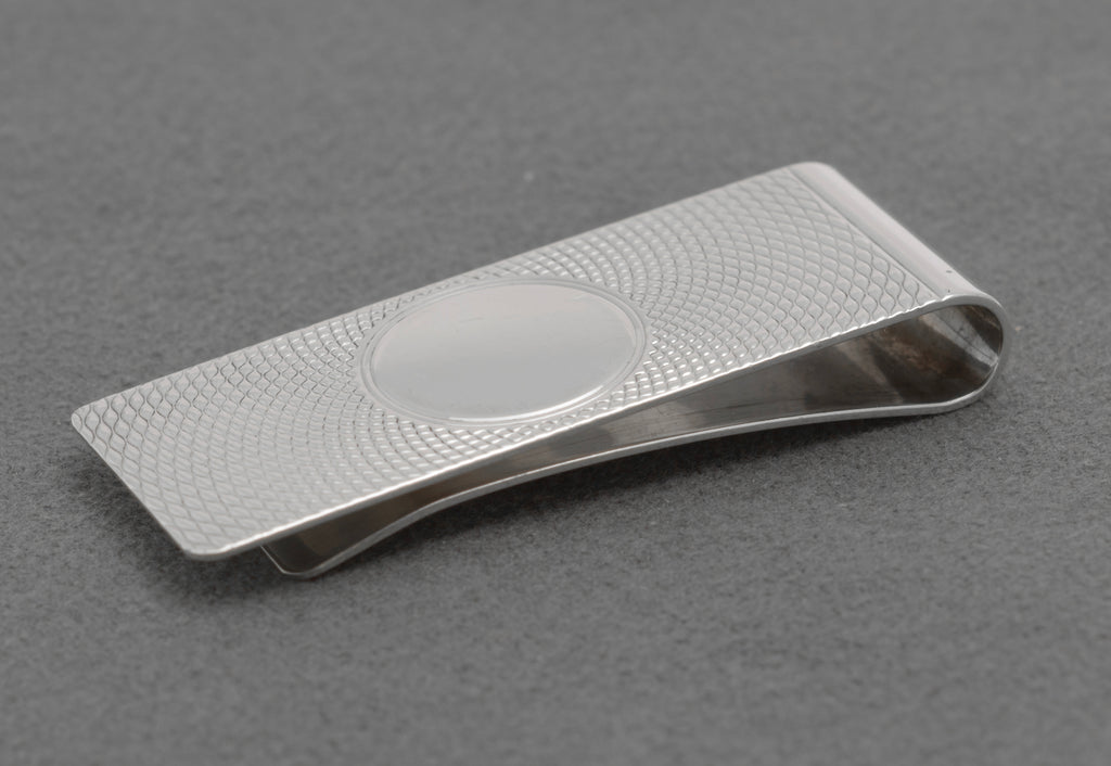 Side profile of vintage sterling silver money clip showing the curved folded edge and clip tension