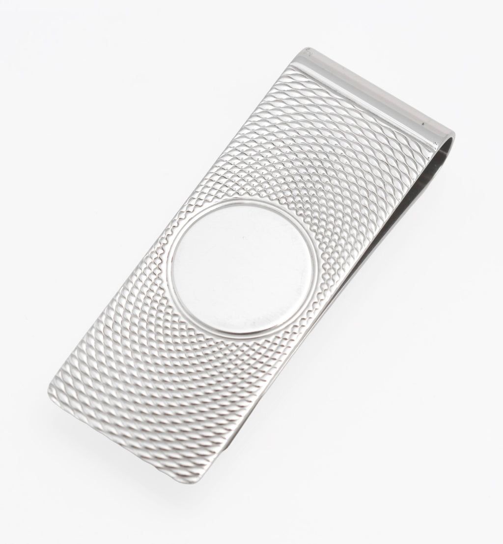 Close view of the WM maker's mark, assay marks and 1983 date mark on the sterling silver money clip