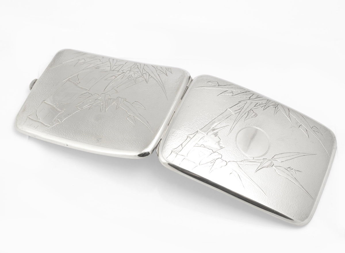 Antique Chinese export sterling silver cigarette case partly open showing the hinge and engraved bamboo decoration