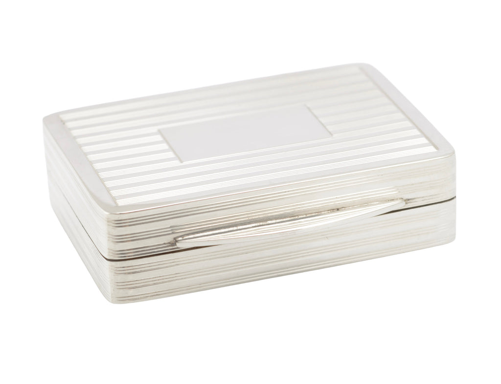Close view of the reeded lid and vacant rectangular cartouche on a vintage sterling silver box