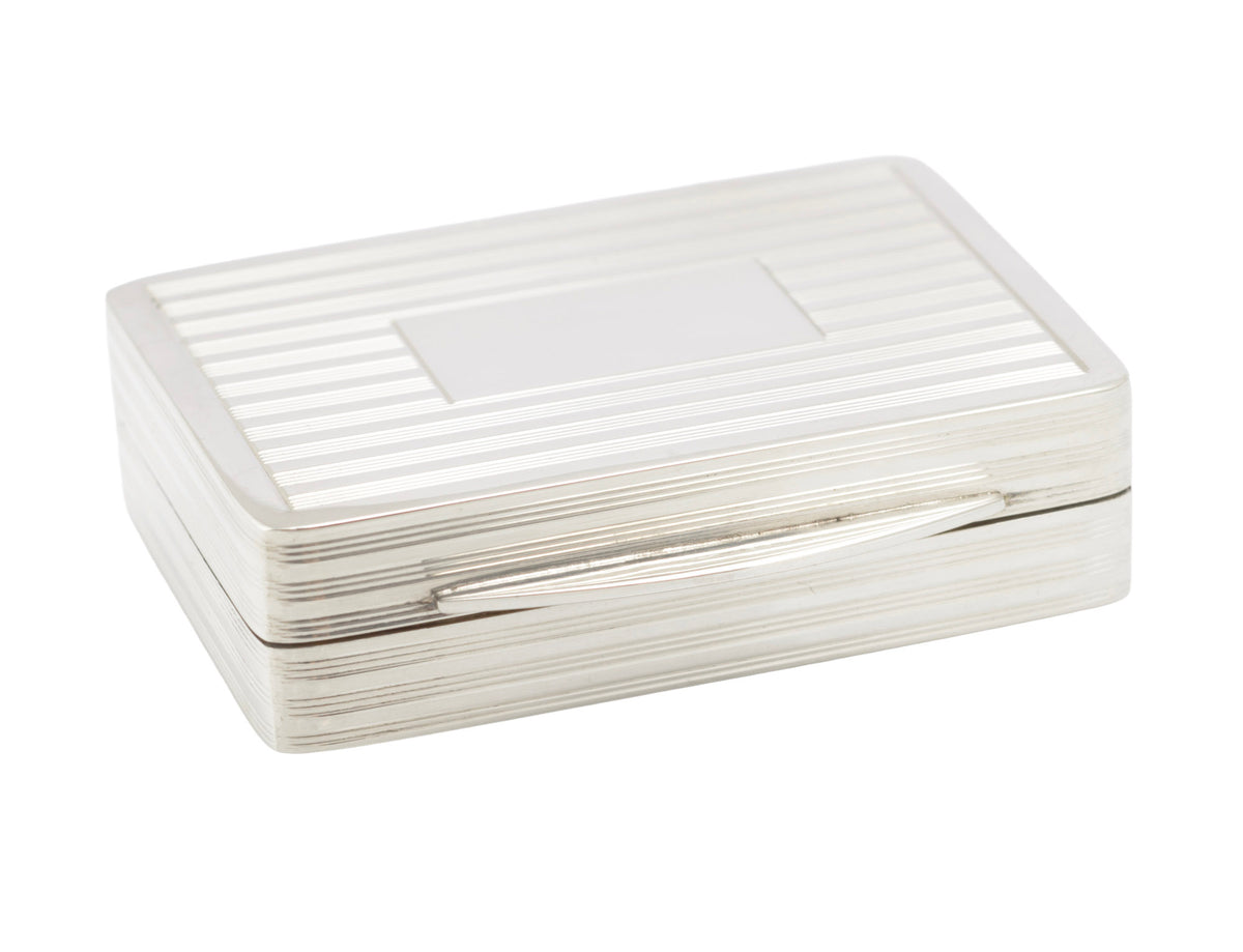 Close view of the reeded lid and vacant rectangular cartouche on a vintage sterling silver box