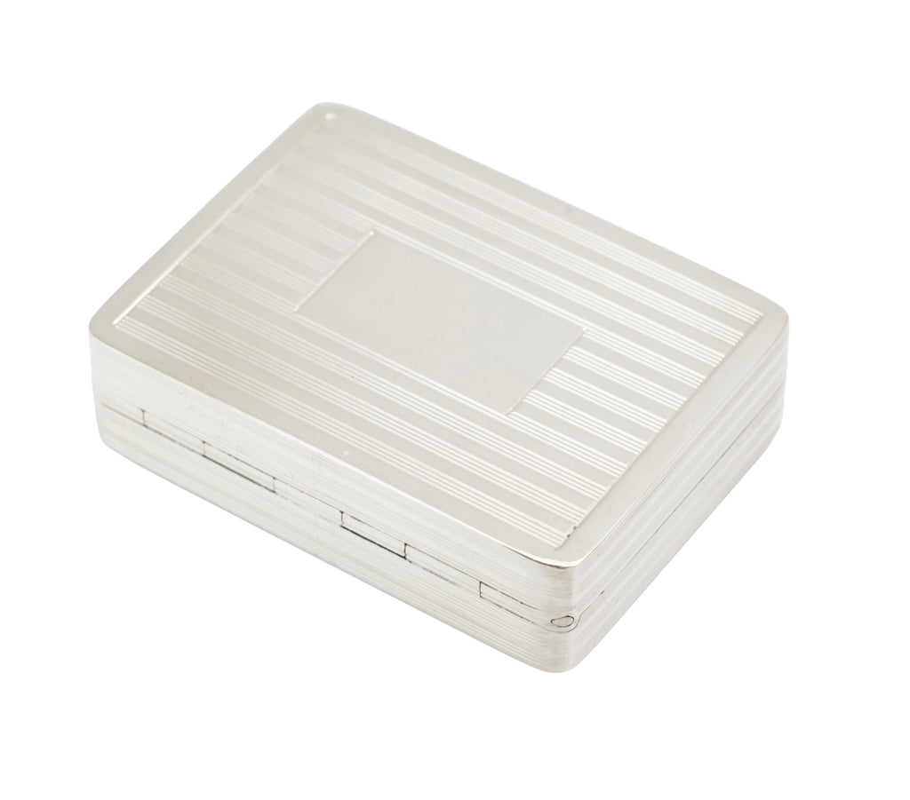 Side view of vintage Peter John Doherty sterling silver box showing rounded corners and linear reeding