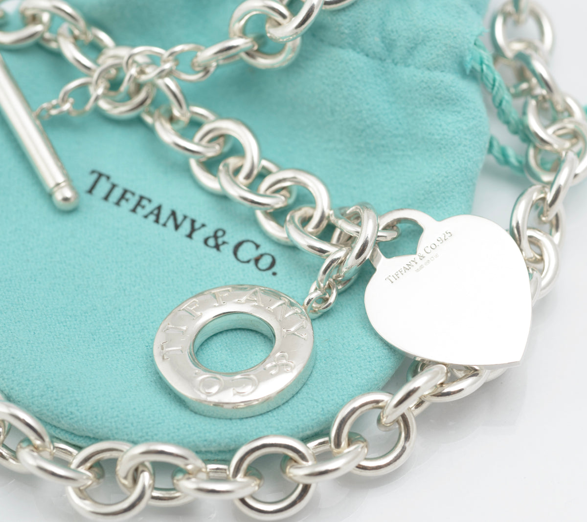 Vintage Tiffany and Co sterling silver Heart Tag necklace shown fully laid out with heart tag and circular toggle disc