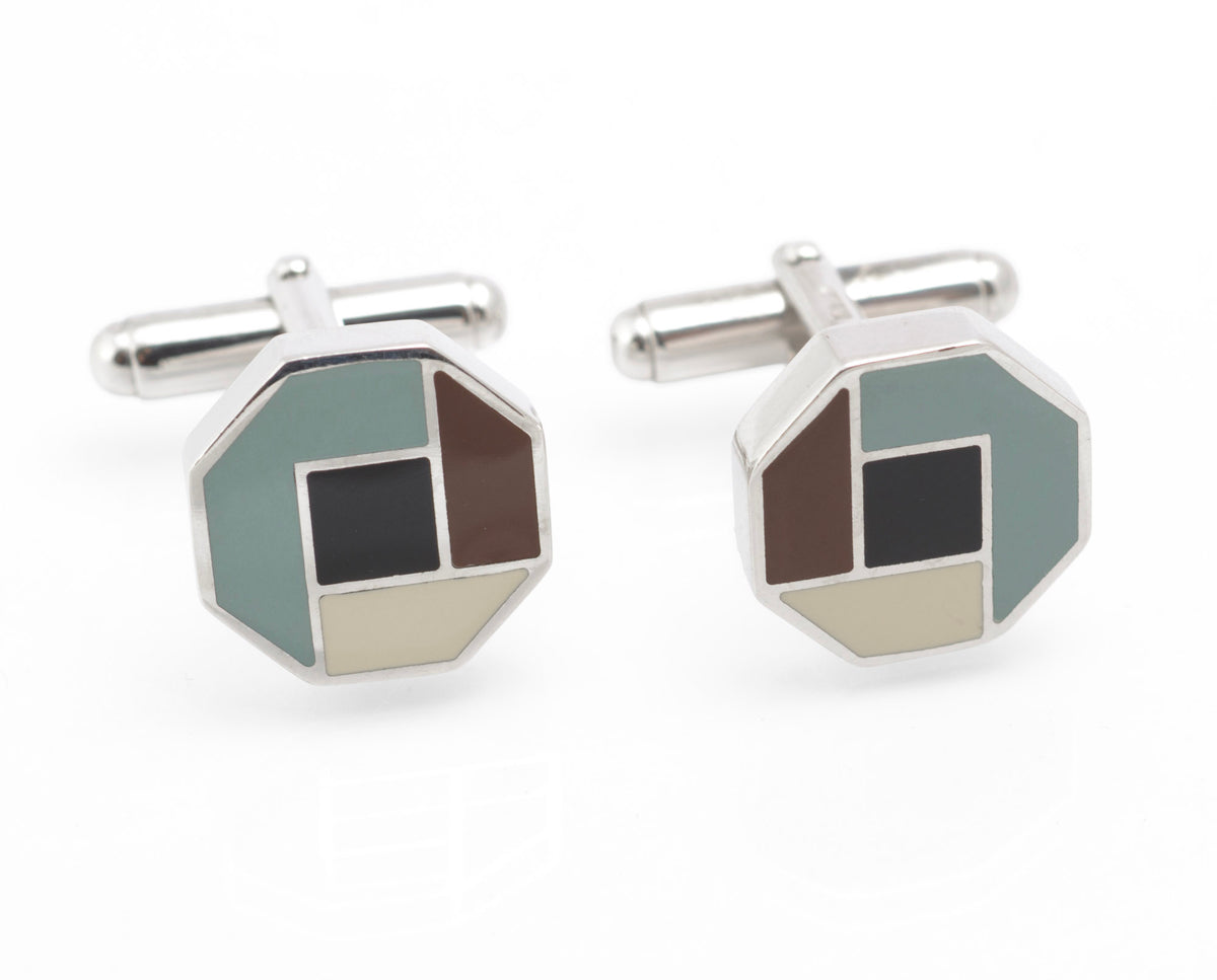Angled view of vintage Prada sterling silver geometric enamel cufflinks showing the articulated toggle fittings