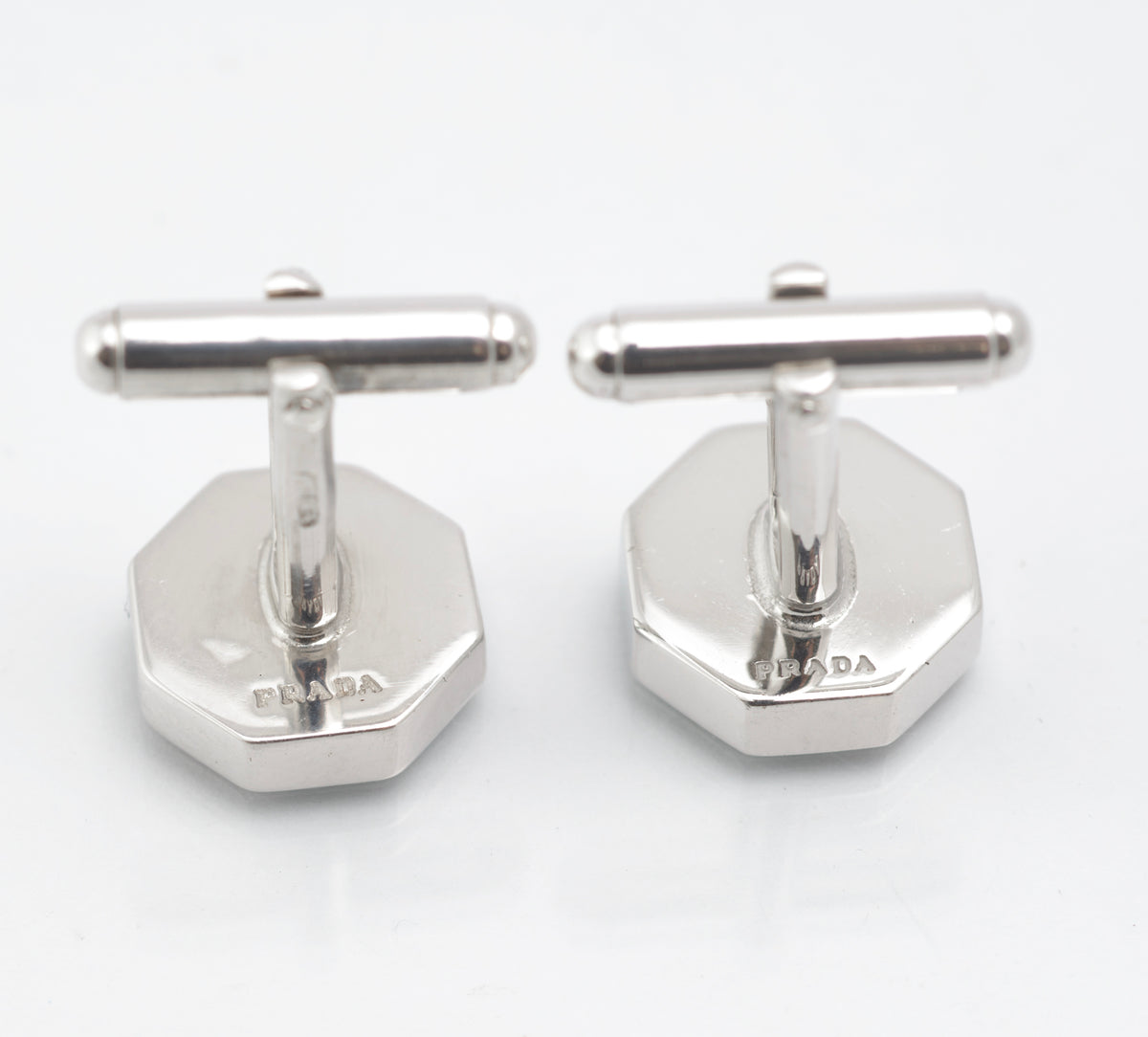 Vintage Prada sterling silver geometric enamel cufflinks displayed in the original black presentation box
